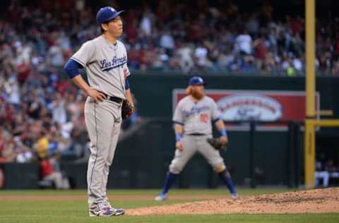 Apr 22, 2017; Phoenix, AZ, USA; Los Angeles Dodgers starting pitcher Kenta Maeda (18) reacts after giving up a home run to the Arizona Diamondbacks in the fourth inning at Chase Field. Mandatory Credit: Jennifer Stewart-USA TODAY Sports