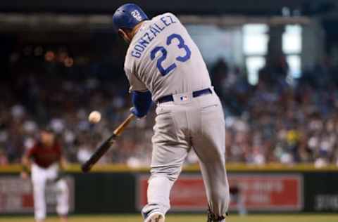 Apr 23, 2017; Phoenix, AZ, USA; Los Angeles Dodgers first baseman Adrian Gonzalez (23) hits a two RBI double against the Arizona Diamondbacks during the fifth inning at Chase Field. Mandatory Credit: Joe Camporeale-USA TODAY Sports