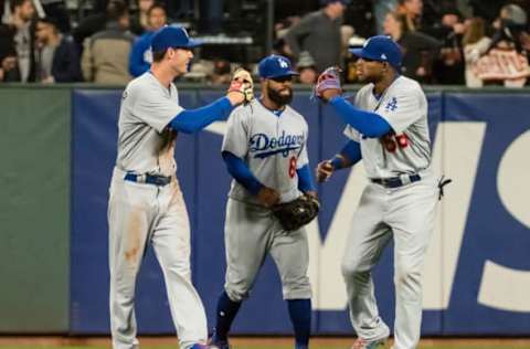 Apr 25, 2017; San Francisco, CA, USA; Los Angeles Dodgers left fielder Cody Bellinger (35), center fielder Andrew Toles (60) and right fielder Yasiel Puig (66) celebrate after the win against the San Francisco Giants at AT&T Park. The Los Angeles Dodgers defeated the San Francisco Giants 2-1. Mandatory Credit: Kelley L Cox-USA TODAY Sports