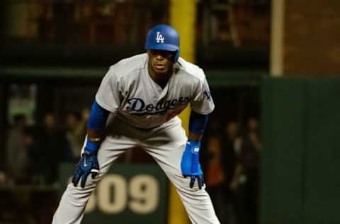 Apr 25, 2017; San Francisco, CA, USA; Los Angeles Dodgers right fielder Yasiel Puig (66) takes a lead off first base against the San Francisco Giants during the eighth inning at AT&T Park. Mandatory Credit: Kelley L Cox-USA TODAY Sports