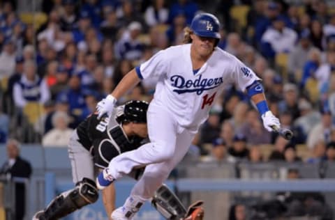 Apr 25, 2016; Los Angeles, CA, USA; Los Angeles Dodgers third baseman Kike Hernandez (14) runs to first on a dropped third strike against the Miami Marlins during a MLB game at Dodger Stadium. Mandatory Credit: Kirby Lee-USA TODAY Sports