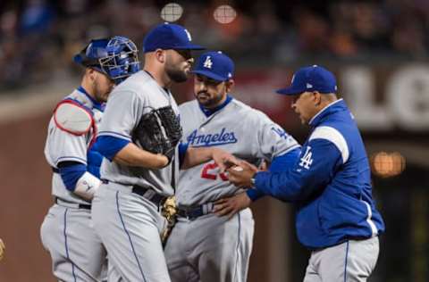 Apr 24, 2017; San Francisco, CA, USA; Los Angeles Dodgers relief pitcher Adam Liberatore (36) is relieved by manager Dave Roberts (30) in the seventh inning against the San Francisco Giants at AT&T Park. The Giants won 2-1. Mandatory Credit: John Hefti-USA TODAY Sports