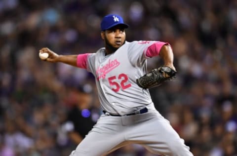 May 13, 2017; Denver, CO, USA; Los Angeles Dodgers relief pitcher Pedro Baez (52) delivers a pitch in the eighth inning against the Colorado Rockies at Coors Field. Mandatory Credit: Ron Chenoy-USA TODAY Sports