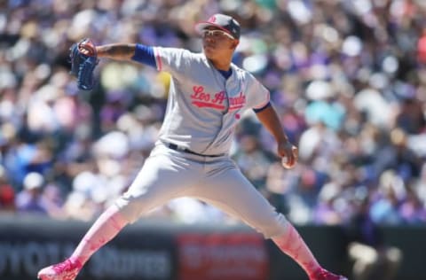 May 14, 2017; Denver, CO, USA; Los Angeles Dodgers starting pitcher Julio Urias (7) delivers a pitch during the fourth inning against the Colorado Rockies at Coors Field. Mandatory Credit: Chris Humphreys-USA TODAY Sports