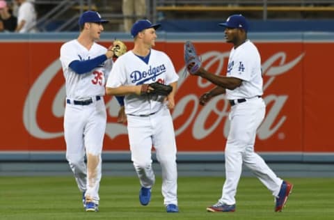 May 18, 2017; Los Angeles, CA, USA; Los Angeles Dodgers left fielder Cody Bellinger (35), and center fielder Joc Pederson (middle) and right fielder Yasiel Puig (right) celebrate after defeating the Miami Marlins 7-2 at Dodger Stadium. Mandatory Credit: Richard Mackson-USA TODAY Sports