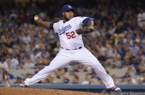 May 3, 2017; Los Angeles, CA, USA; Los Angeles Dodgers pitcher Pedro Baez (52) delivers a pitch against the San Francisco Giants during a MLB game at Dodger Stadium. The Giants defeated the Dodgers 4-1 in 11 innings. Mandatory Credit: Kirby Lee-USA TODAY Sports