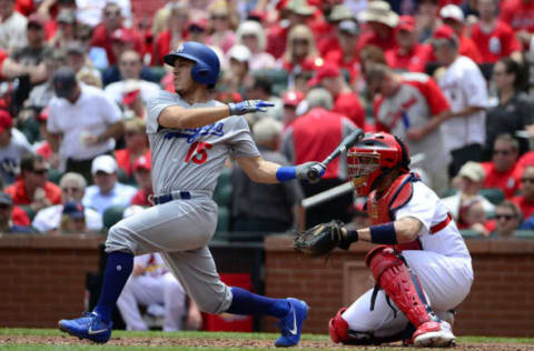 Jun 1, 2017; St. Louis, MO, USA; Los Angeles Dodgers catcher Austin Barnes (15) hits a single off of St. Louis Cardinals starting pitcher Adam Wainwright (not pictured) during the second inning at Busch Stadium. Mandatory Credit: Jeff Curry-USA TODAY Sports