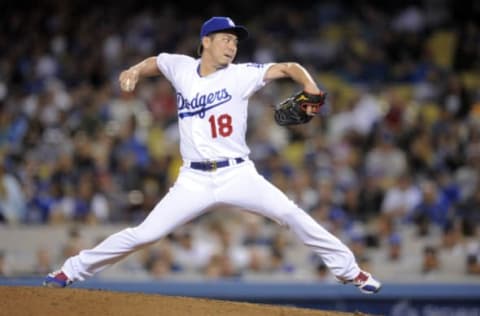 Jun 9, 2017; Los Angeles, CA, USA; Los Angeles Dodgers starting pitcher Kenta Maeda (18) throws in the sixth inning against the Cincinnati Reds at Dodger Stadium. Mandatory Credit: Gary A. Vasquez-USA TODAY Sports