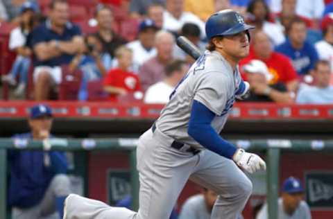 Aug 26, 2015; Cincinnati, OH, USA; Los Angeles Dodgers center fielder Kike Hernandez runs to first after hitting an RBI single against the Cincinnati Reds in the second inning at Great American Ball Park. Mandatory Credit: David Kohl-USA TODAY Sports