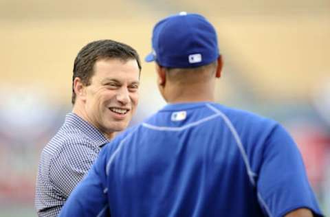 October 17, 2016; Los Angeles, CA, USA; Los Angeles Dodgers executive Andrew Friedman (L) speaks with manager Dave Roberts (30) during workouts before game three of the NLCS at Dodgers Stadium. Mandatory Credit: Gary A. Vasquez-USA TODAY Sports