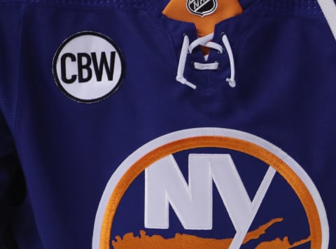 NEW YORK, NEW YORK – OCTOBER 24: A close-up view of an New York Islanders during warm-ups prior to the game against the Florida Panthers. The Islanders jersey now bears a patch for former owner Charles Wang who passed away in October. (Photo by Bruce Bennett/Getty Images)