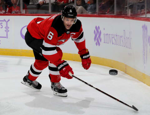 NEWARK, NEW JERSEY – NOVEMBER 23: Andy Greene #6 of the New Jersey Devils goes after the puck in the second period against the New York Islanders at Prudential Center on November 23, 2018 in Newark, New Jersey. (Photo by Elsa/Getty Images)