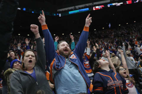 UNIONDALE, NEW YORK – DECEMBER 01: Fans celebrate a second period goal by Anders Lee #27 of the New York Islanders against the Columbus Blue Jackets at the Nassau Veterans Memorial Coliseum on December 01, 2018 in Uniondale, New York. The Islanders were playing in their first regular season game since April of 2015 when the team moved their home games to the Barclays Center in Brooklyn. The Islanders defeated the Blue Jackets 3-2. (Photo by Bruce Bennett/Getty Images)