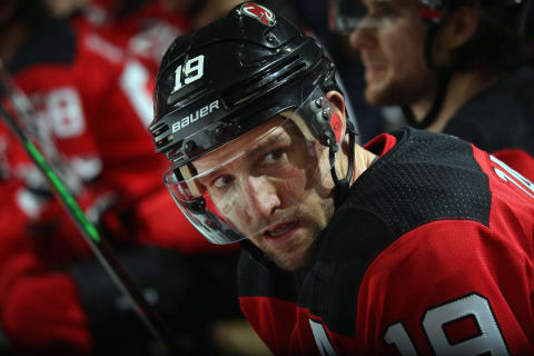 NEWARK, NEW JERSEY – JANUARY 19: Travis Zajac #19 of the New Jersey Devils sits on the bench during the game against the Anaheim Ducks at the Prudential Center on January 19, 2019 in Newark, New Jersey. The Ducks defeated the Devils 3-2. (Photo by Bruce Bennett/Getty Images)