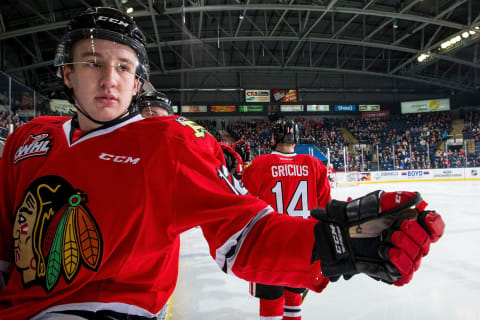 New York Islanders propsect Reece Newkirk #12 sits on the boards after fist bumping Jake Gricius #14 of the Portland Winterhawks (Photo by Marissa Baecker/Getty Images)