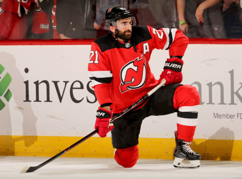 NEWARK, NEW JERSEY – MARCH 19: Kyle Palmieri #21 of the New Jersey Devils stretches during warmups before the game against the Washington Capitals at Prudential Center on March 19, 2019 in Newark, New Jersey. (Photo by Elsa/Getty Images)