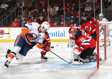 NEWARK, NEW JERSEY – SEPTEMBER 21: Anders Lee #27 of the New York Islanders moves in on Cory Schneider #35 of the New Jersey Devils at the Prudential Center on September 21, 2019 in Newark, New Jersey. The Devils defeated the Islanders 4-3. (Photo by Bruce Bennett/Getty Images)