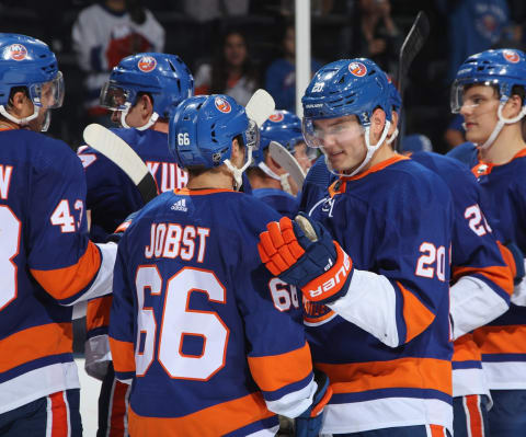 UNIONDALE, NEW YORK – SEPTEMBER 23: Mason Jobst #66 and Kieffer Bellows #20 of the New York Islanders celebrate a 3-2 victory over the Detroit Red Wings at NYCB Live’s Nassau Coliseum on September 23, 2019 in Uniondale, New York. The Islanders defeated the Red wings 3-2 in overtime. (Photo by Bruce Bennett/Getty Images)