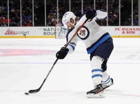 Patrik Laine #29 of the Winnipeg Jets takes the first period shot against the New York Islanders (Photo by Bruce Bennett/Getty Images)