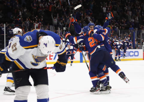 UNIONDALE, NEW YORK – OCTOBER 14: The New York Islanders celebrate the game winning goal by Devon Toews #25 against the St. Louis Blues at 1:13 of overtime at NYCB Live’s Nassau Coliseum on October 14, 2019 in Uniondale, New York. The Islanders defeated the Blues 3-2 in overtime.(Photo by Bruce Bennett/Getty Images)