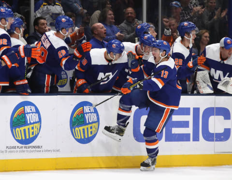 UNIONDALE, NEW YORK – OCTOBER 14: Mathew Barzal #13 of the New York Islanders celebrates the game tying goal by Anders Lee #27 against the St. Louis Blues at NYCB Live’s Nassau Coliseum on October 14, 2019 in Uniondale, New York. The Islanders defeated the Blues 3-2 in overtime. (Photo by Bruce Bennett/Getty Images)