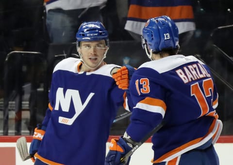 NEW YORK, NEW YORK – NOVEMBER 21: Anthony Beauvillier #18 (L) celebrates his second period goal against the Pittsburgh Penguins along with Mathew Barzal #13 of the New York Islanders at the Barclays Center on November 21, 2019 in the Brooklyn borough of New York City. (Photo by Bruce Bennett/Getty Images)