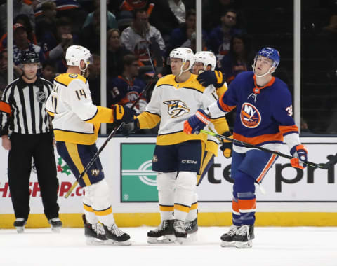 UNIONDALE, NEW YORK – DECEMBER 17: Mattias Ekholm #14 of the Nashville Predators (L) celebrates his go-ahead goal at 19:12 of the second period against the New York Islanders at NYCB Live’s Nassau Coliseum on December 17, 2019 in Uniondale, New York. (Photo by Bruce Bennett/Getty Images)