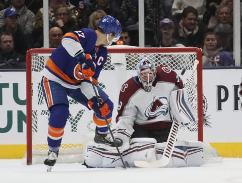 UNIONDALE, NEW YORK – JANUARY 06: Anders Lee #27 of the New York Islanders attempts to deflect the puck past Pavel Francouz #39 of the Colorado Avalanche during the first period at NYCB Live’s Nassau Coliseum on January 06, 2020 in Uniondale, New York. (Photo by Bruce Bennett/Getty Images)