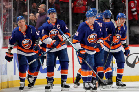 NEWARK, NEW JERSEY – JANUARY 07: Anders Lee #27 of the New York Islanders and the rest of his teammates celebrate the overtime win over the New Jersey Devils at Prudential Center on January 07, 2020 in Newark, New Jersey.The New York Islanders defeated the New Jersey Devils 4-3 in overtime. (Photo by Elsa/Getty Images)