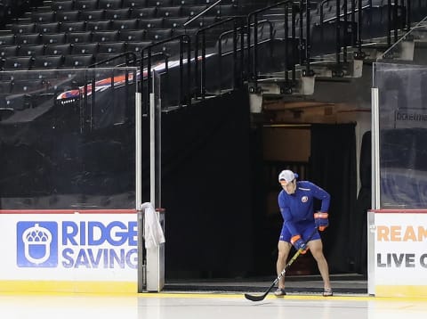 NEW YORK, NEW YORK – JANUARY 11: Mathew Barzal #13 of the New York Islanders practices with the puck prior to the game against the Boston Bruins at the Barclays Center on January 11, 2020 in the Brooklyn borough of New York City. (Photo by Bruce Bennett/Getty Images)