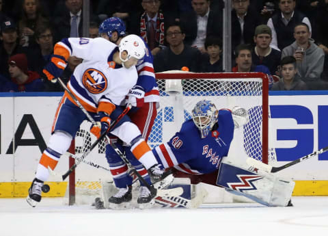 NEW YORK, NEW YORK – JANUARY 13: Alexandar Georgiev #40 of the New York Rangers makes the second period save as Derick Brassard #10 of the New York Islanders looks for a reboundat Madison Square Garden on January 13, 2020 in New York City. (Photo by Bruce Bennett/Getty Images)