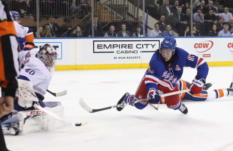 NEW YORK, NEW YORK – JANUARY 13: Mika Zibanejad #93 of the New York Rangers takes the shot against Semyon Varlamov #40 of the New York Islanders at Madison Square Garden on January 13, 2020 in New York City. The Rangers defeated the Islanders 6-2. (Photo by Bruce Bennett/Getty Images)