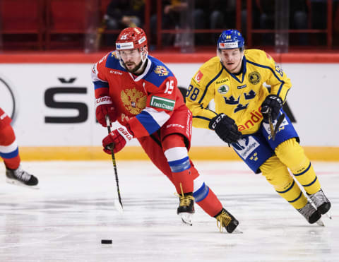 Russia’s Anatoly Golyshev vies for the puck with Sweden’s Malte Stromwall during the Beijer Hockey Games match between Sweden and Russia at the Ericson Globe Arena in Stockholm, Sweden, on February 08, 2020. (Photo by Erik SIMANDER / TT NEWS AGENCY / AFP) / Sweden OUT (Photo by ERIK SIMANDER/TT NEWS AGENCY/AFP via Getty Images)