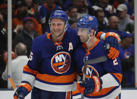 UNIONDALE, NEW YORK – JANUARY 14: Johnny Boychuk #55 and Nick Leddy #2 of the New York Islanders celebrate their 8-2 victory over the Detroit Red Wings at NYCB Live’s Nassau Coliseum on January 14, 2020 in Uniondale, New York. (Photo by Bruce Bennett/Getty Images)