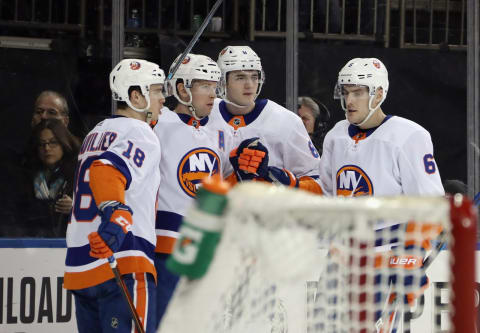 NEW YORK, NEW YORK – JANUARY 21: Josh Bailey #12 of the New York Islanders (2nd from left) celebrates his power-play goal at 13:35 of the first period against the New York Rangers at Madison Square Garden on January 21, 2020 in New York City. (Photo by Bruce Bennett/Getty Images)