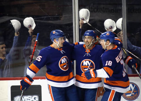 NEW YORK, NEW YORK – FEBRUARY 01: Jordan Eberle #7 of the New York Islanders (C) celebrates his second period goal against the Vancouver Canucks and is joined by Devon Toews #25 (L) and Anthony Beauvillier #18 (R) at the Barclays Center on February 01, 2020 in the Brooklyn borough of New York City. (Photo by Bruce Bennett/Getty Images)