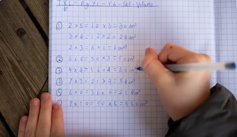 CARDIFF, UNITED KINGDOM – JANUARY 08: A primary school child writes in a school book while studying maths in a classroom on January 8, 2020 in Cardiff, United Kingdom. (Photo by Matthew Horwood/Getty Images)