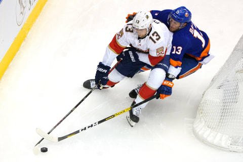 Mark Pysyk #13 of the Florida Panthers skates against Mathew Barzal #13 of the New York Islanders (Photo by Andre Ringuette/Freestyle Photo/Getty Images)