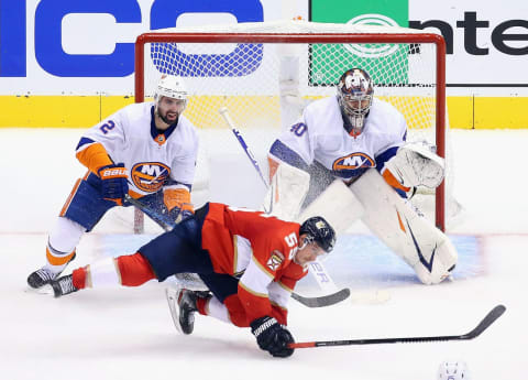 Nick Leddy #2 of the New York Islanders checks Noel Acciari #55 of the Florida Panthers (Photo by Andre Ringuette/Freestyle Photo/Getty Images)