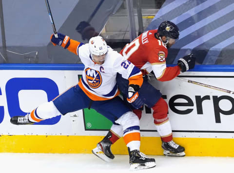 Anders Lee #27 of the New York Islanders checks Brett Connolly #10 of the Florida Panthers (Photo by Andre Ringuette/Freestyle Photo/Getty Images)