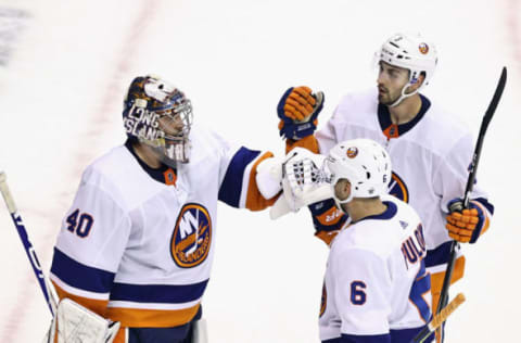 Adam Pelech #3 and Ryan Pulock #6 of the New York Islanders. (Photo by Elsa/Getty Images)