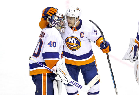 Semyon Varlamov #40 and Anders Lee #27 of the New York Islanders. (Photo by Elsa/Getty Images)