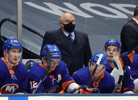 UNIONDALE, NEW YORK – JANUARY 21: Head coach Barry Trotz of the New York Islanders handle bench duties against the New Jersey Devils at Nassau Coliseum on January 21, 2021 in Uniondale, New York. (Photo by Bruce Bennett/Getty Images)