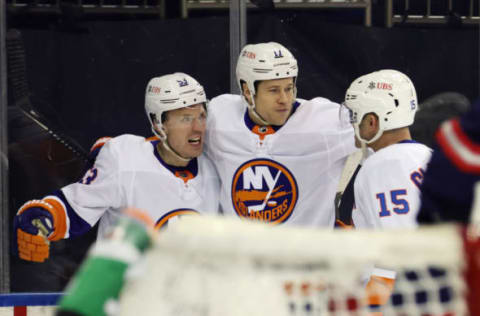 Casey Cizikas #53 of the New York Islanders is joined by Matt Martin #17 and Cal Clutterbuck #15. (Photo by Bruce Bennett/Getty Images)