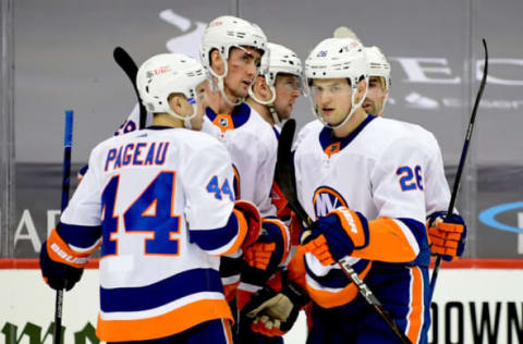 PITTSBURGH, PENNSYLVANIA – FEBRUARY 18: The New York Islanders celebrate a third period goal by Brock Nelson #29 against the Pittsburgh Penguins at PPG PAINTS Arena on February 18, 2021 in Pittsburgh, Pennsylvania. (Photo by Emilee Chinn/Getty Images)