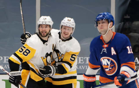 Kris Letang #58 of the Pittsburgh Penguins celebrates his goal at 2:43 of the second period against the New York Islanders. (Photo by Bruce Bennett/Getty Images)