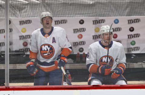 Cal Clutterbuck #15 and Ryan Pulock #6 of the New York Islanders. (Photo by Elsa/Getty Images)