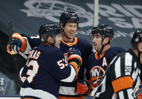 The line of Casey Cizikas #53, Matt Martin #17 and Cal Clutterbuck #15 of the New York Islanders. (Photo by Bruce Bennett/Getty Images)