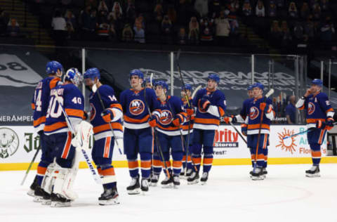 UNIONDALE, NEW YORK – APRIL 20: The New York Islanders celebrate a 6-1 victory over the New York Rangers at the Nassau Coliseum on April 20, 2021 in Uniondale, New York. (Photo by Bruce Bennett/Getty Images)