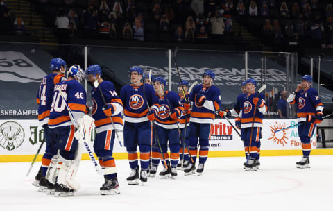 The New York Islanders celebrate a 6-1 victory over the New York Rangers at the Nassau Coliseum. (Photo by Bruce Bennett/Getty Images)